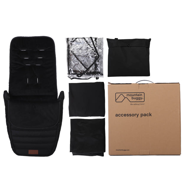 flat lay of nano urban accessory plack including foot muff storm mesh blackout covers