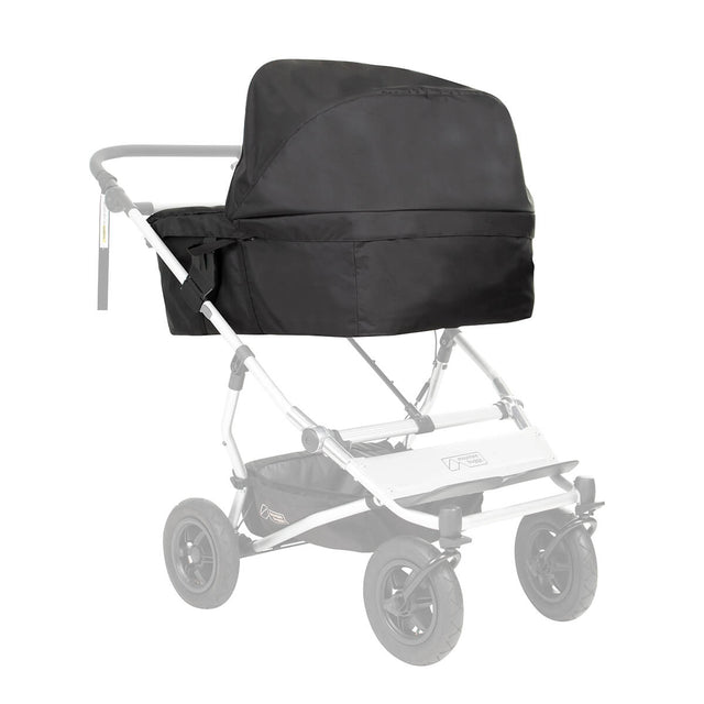carrycot plus for twins installed on a Mountain Buggy duet double stroller ghosted shown from front side angle with sun hood up in place_black