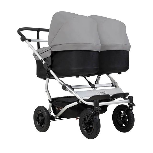 mountain buggy duet double buggy with two carrycot plus in lie flat mode 3/4 view shown in color silver_silver