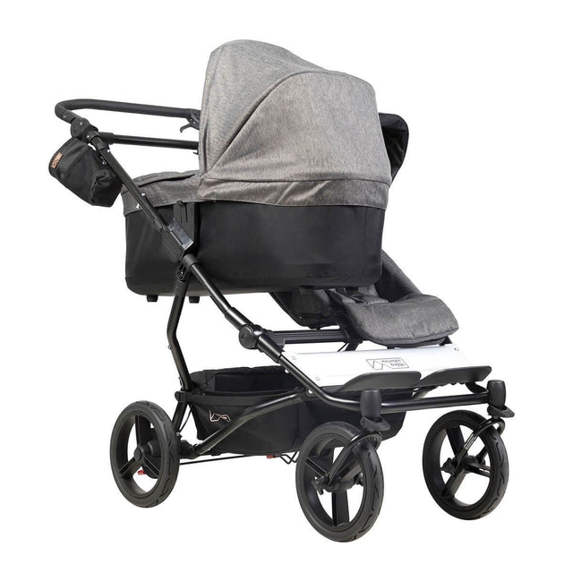 mountain buggy duet double buggy with one carrycot plus in lie flat mode 3/4 view shown in color herringbone_herringbone