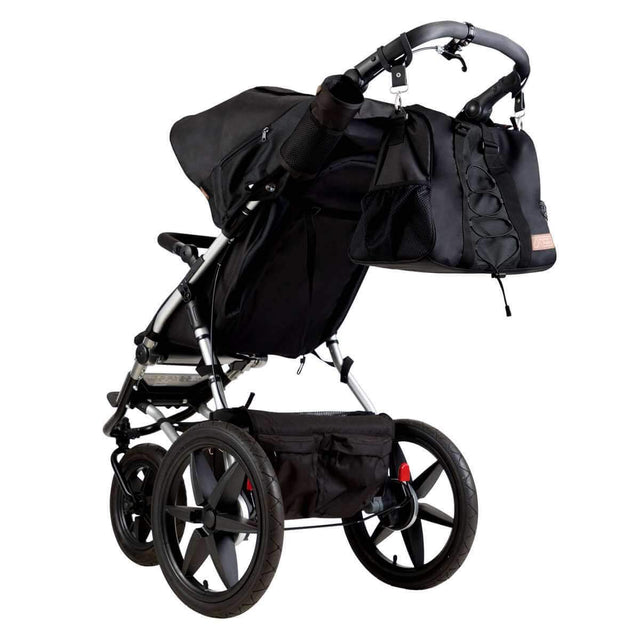 Mountain Buggy duffel bag attached to a terrain buggy in colour onyx_onyx