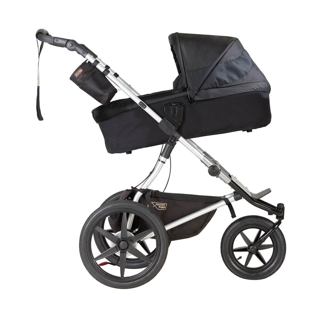 Mountain Buggy carrycot plus on terrain in incline mode in colour onyx_onyx
