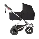 Mountain-Buggy-black-carrycot-plus-on-swift-buggy-in-lie-flat-mode-side-view.webp