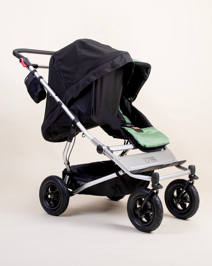 mountain-buggy-carrycot-plus-toddler-seat-Blackoutcover-on-Duet-buggy.webp